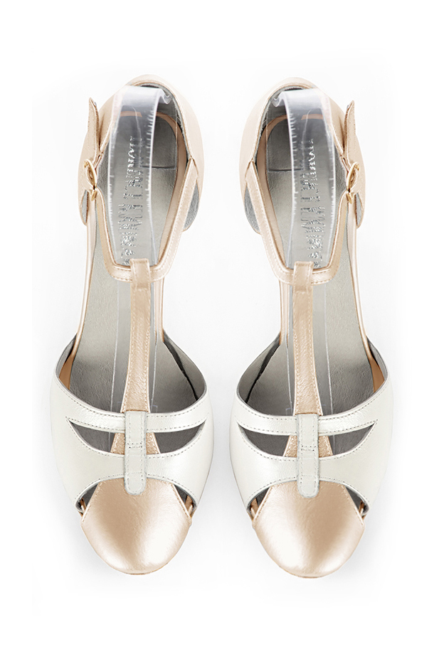 French elegance and refinement for these gold and pure white dress T-strap open side shoes, 
                available in many subtle leather and colour combinations. A pretty model with a comfortable "Salomé" strap and good support.
Its charming spyglass cut-out gives you plenty of scope for personalisation.  
                Matching clutches for parties, ceremonies and weddings.   
                You can customize these shoes to perfectly match your tastes or needs, and have a unique model.  
                Choice of leathers, colours, knots and heels. 
                Wide range of materials and shades carefully chosen.  
                Rich collection of flat, low, mid and high heels.  
                Small and large shoe sizes - Florence KOOIJMAN